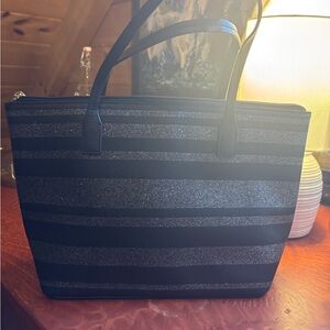 Black and glitter striped Kate Spade hand bag